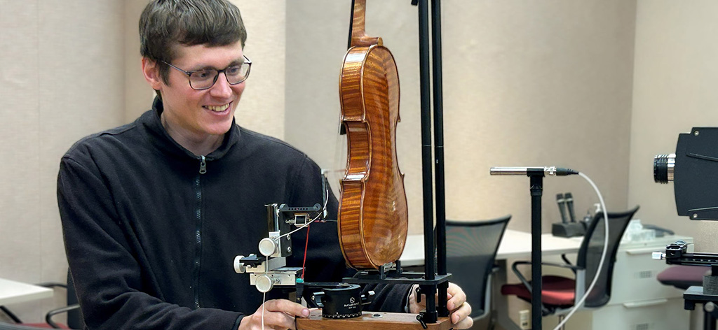 Male violion researcher working with Impulse Measurement Rig